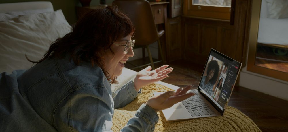 A writer talking into their webcam